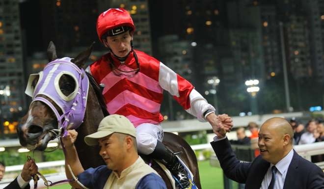 YO-YO DATrainer Chris So welcomes his Danerich winner back to scale in Hong Kong